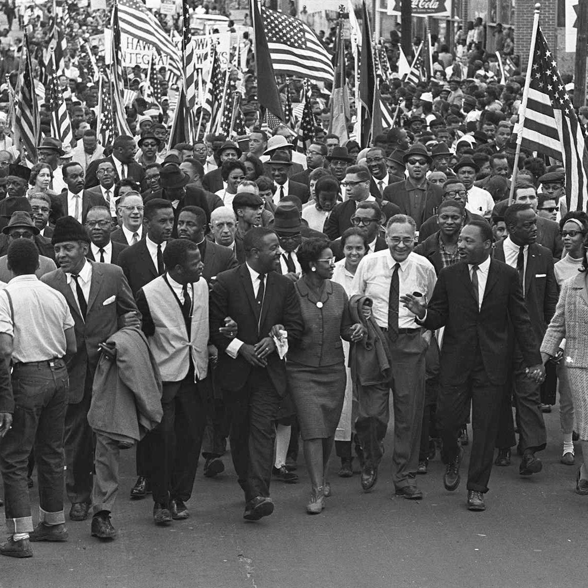 Dr. King marching with others — Public Domain / National Archives